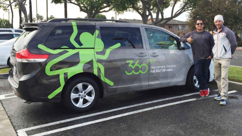 Gray toned vehicle wrap with bright green fly logo designed for 360 Fly Cameras