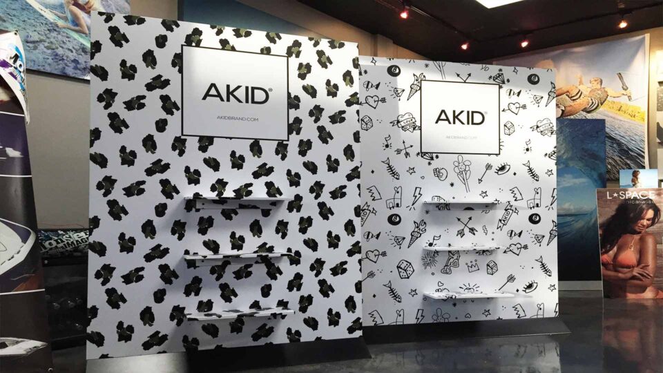 Black and white vinyl graphics on retail temporary wall for AKID