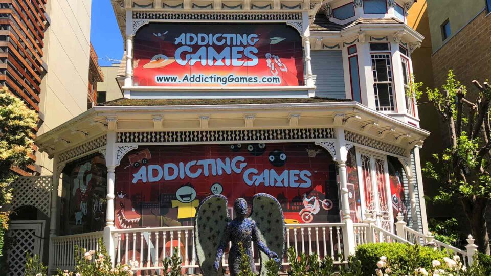 Red Solid Window Graphics on Victorian home featuring cartoon gaming characters