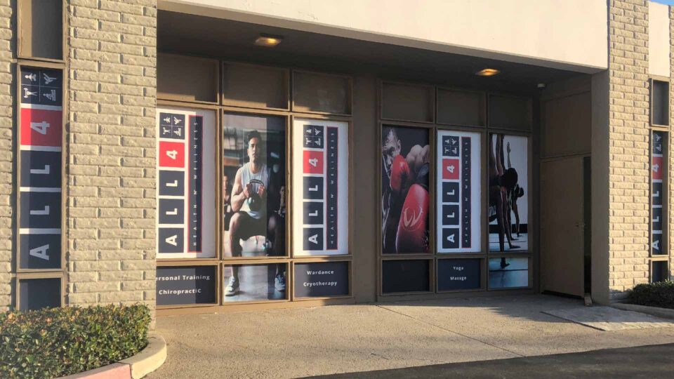 Red,white and black solid window graphics featuring boxer and people exercising for All for Health