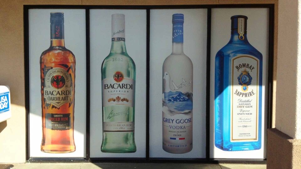 Solid window graphics featuring 4 large bottle of licquor