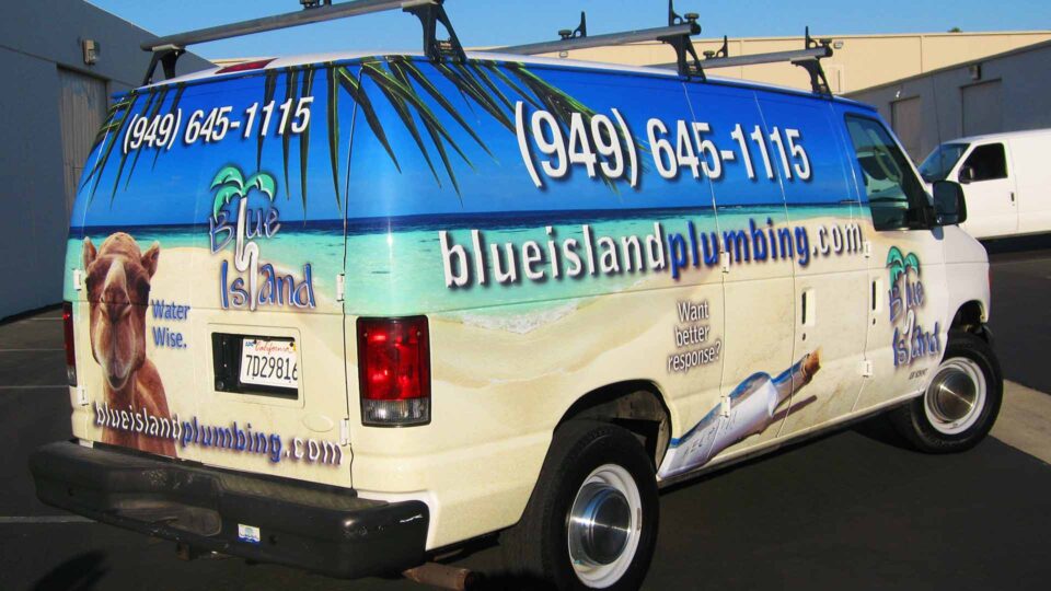 Full Ford van wrap featuring a beach scene for Blue Island Plumbing