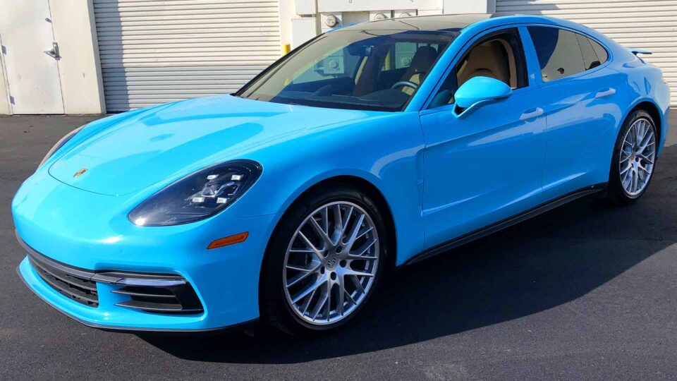 Bright Blue Porsche Panamera Color Change Wrap with White door handles