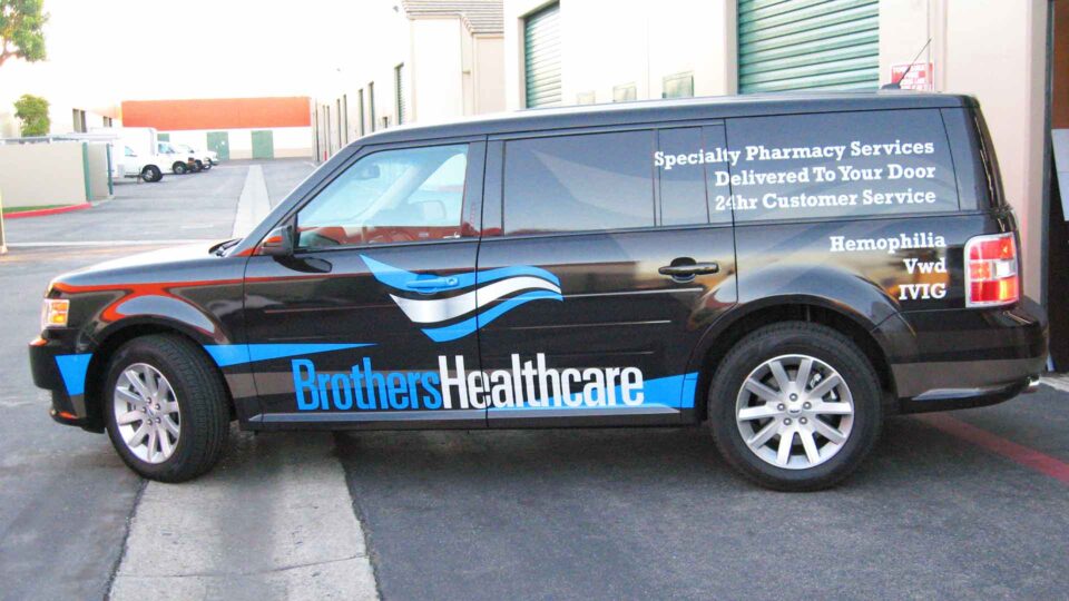 Black Ford Edge with Blue and white and services partial decals