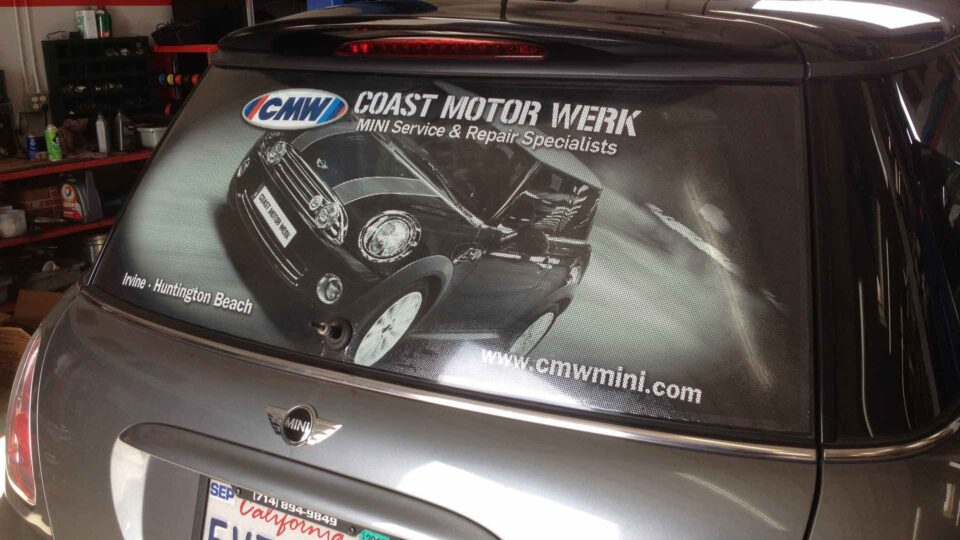 Rear window mini cooper vehicle wrap featuring a mini cooper for Coast Motor Werk