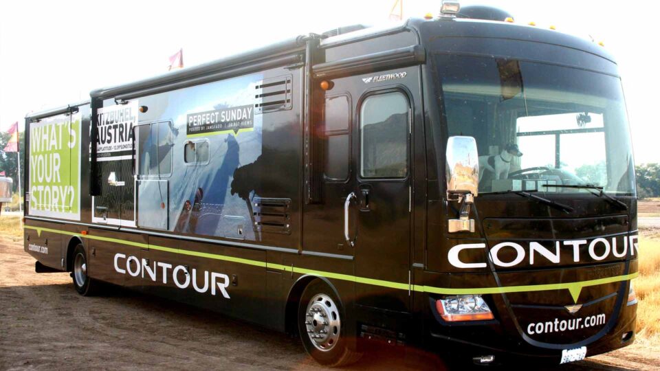 Full Black Motorhome wrap showing skiing imagery for Contour Cameras