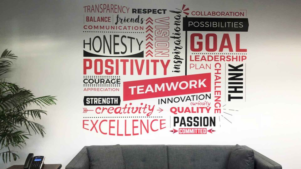 Red and black die cut wall decals of inspirational text