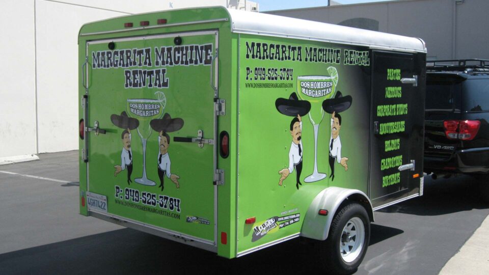 Green fade to black trailer wrap with 2 characters and margarita