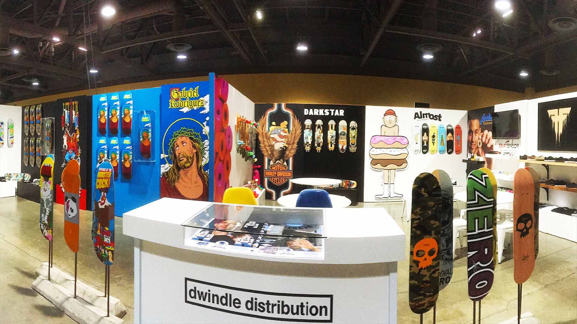 Colorful trade show booth vinyl graphics featuring Darkstar and Almost Skateboard brands for Dwindle Distriubution