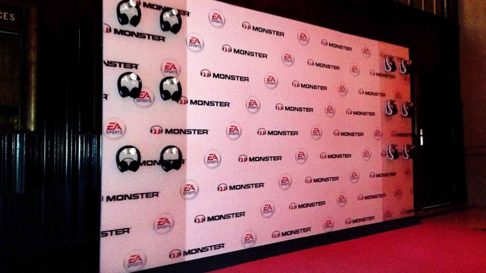 White media wall with Monster and EA Sports logos for special event