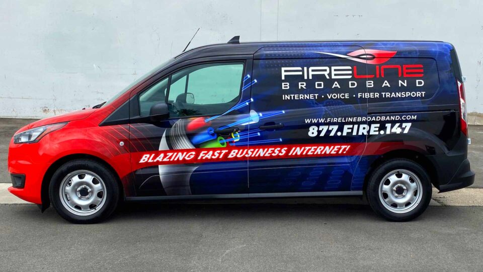 Primarly red and blue full Transit van wrap featuring fast internet service