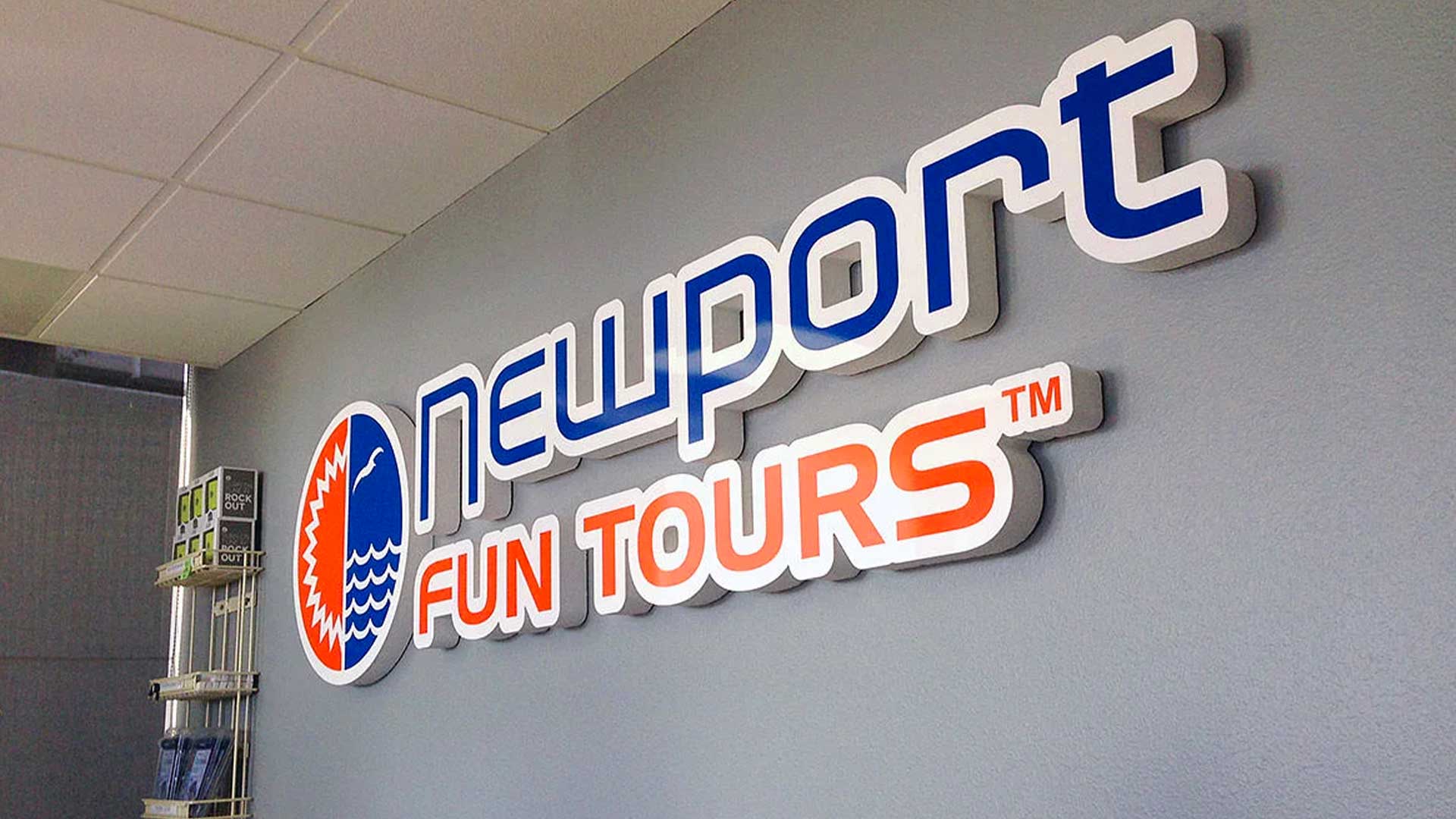Orange, blue and white router cut indoor wall sign for Newport Fun Tours