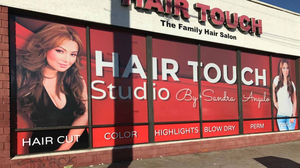 Red background with 2 female models for Hair Touch Studio