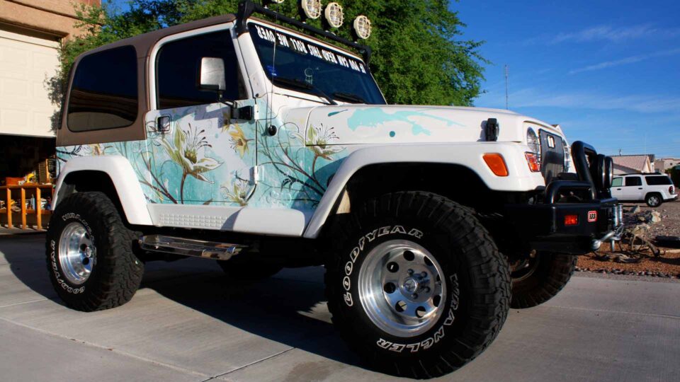 White JEEP with Flowers and blue background partial wrap