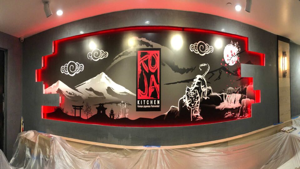Red , black and white wall graphic of mountains and Asian scenery for Koja Kitchen