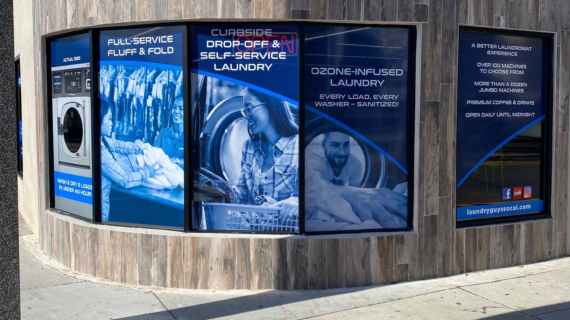 Blue window graphics showing wahsing machine and people doing laundry
