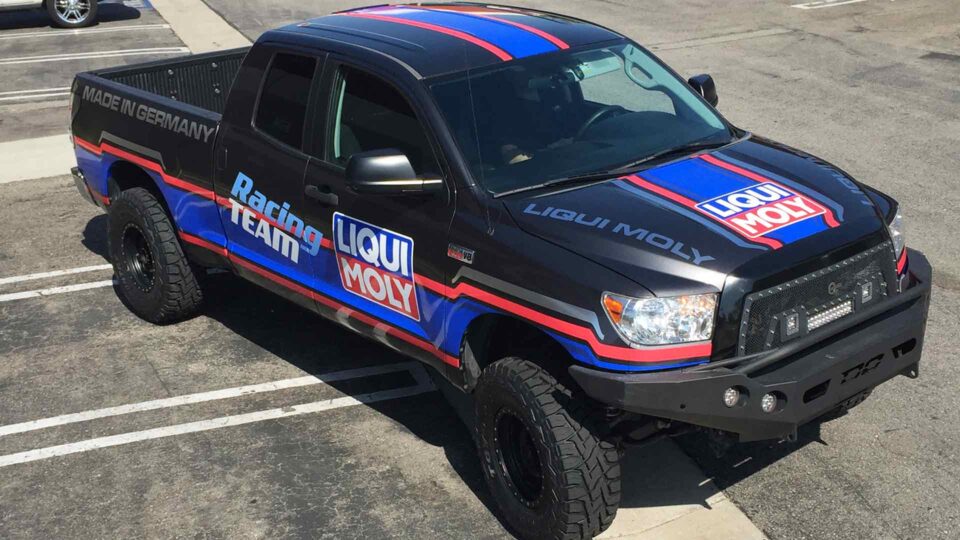 Red, white and blue stripe Partial Tundra Truck Wrap with Liqui Moly logo
