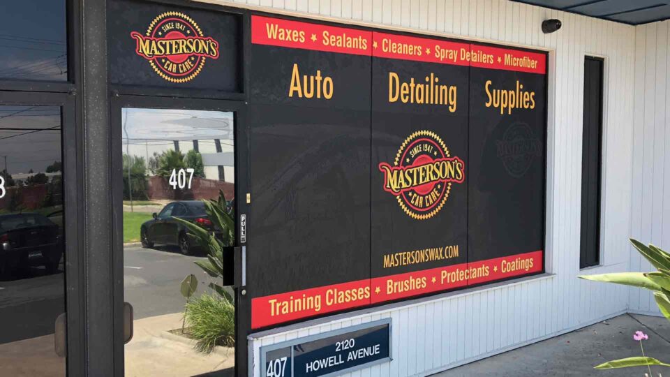 Black, red and gold solid window graphics with Masterson's car care info