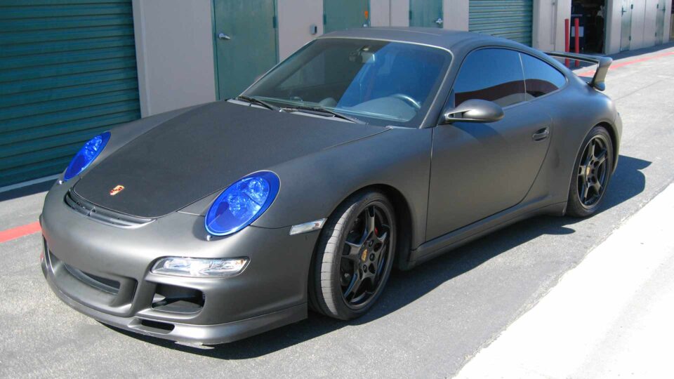 Porsche Carrera Matte Gray Color Change Vehicle Wrap with blue transparent light covering