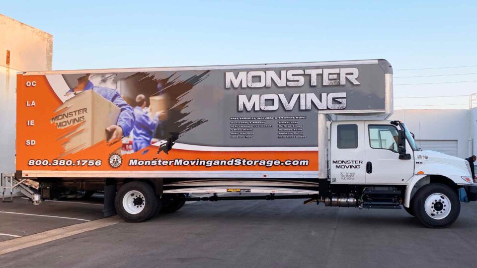 Gray and Orange Box Truck Wrap featuring movers and boxes for Monster Moving