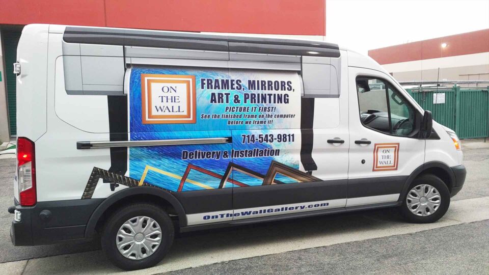 Partial Sprinter Van Wrap featuring a printer and picture frames for On the Wall