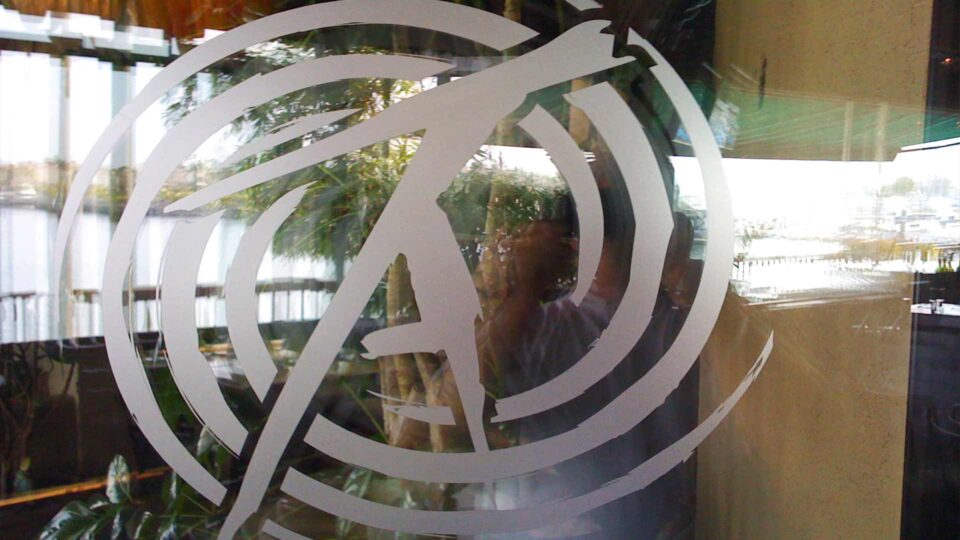 Fosted die cut cirlcle window graphic that has RA logo