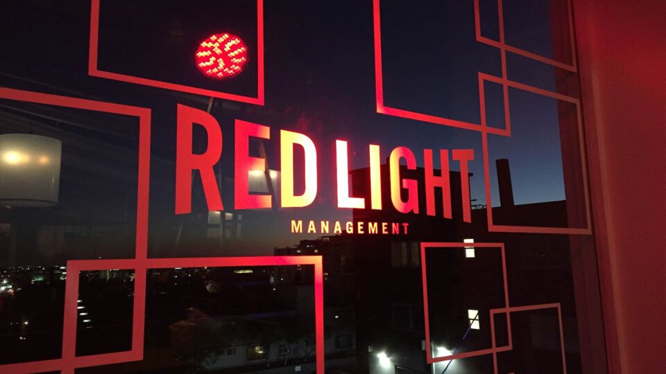 Red geometric die cut window decals and Redlight Logo for special event