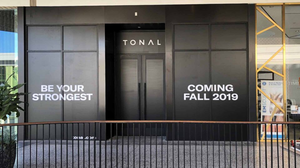 Matte Black Window Graphics with white text for Tonal