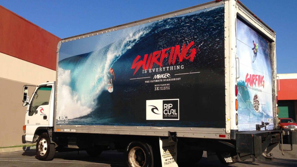 Box truck wrap with surfer on a big wave for Rip Curl surf