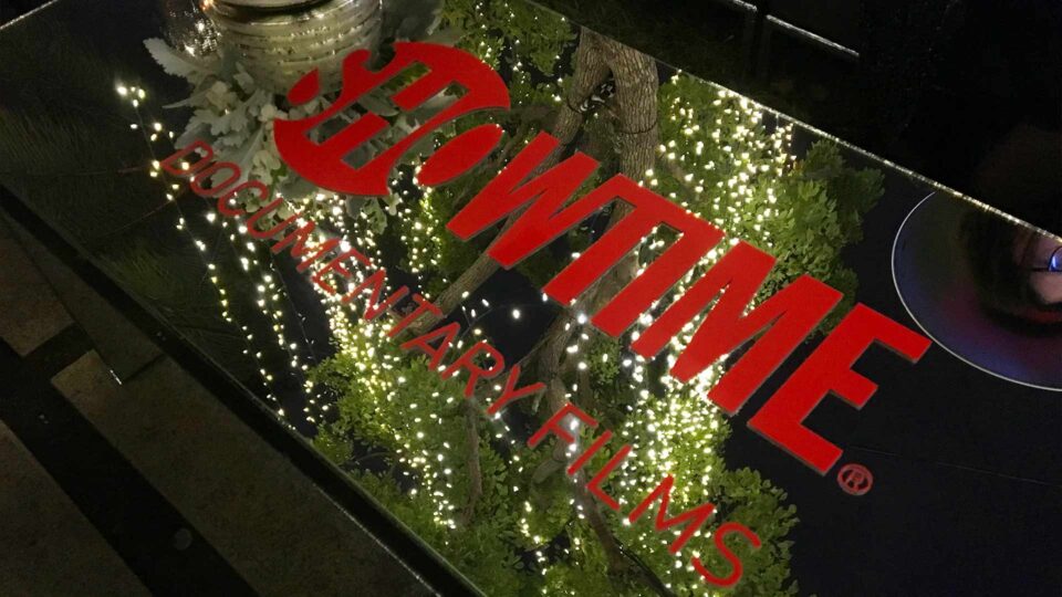 Red Showtime die cut decals on glass table for special event