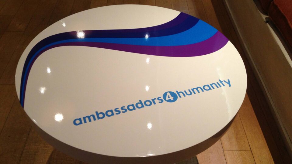 Special event white tabletop decals with blue and purple stripe and ambassadors 4 humanity