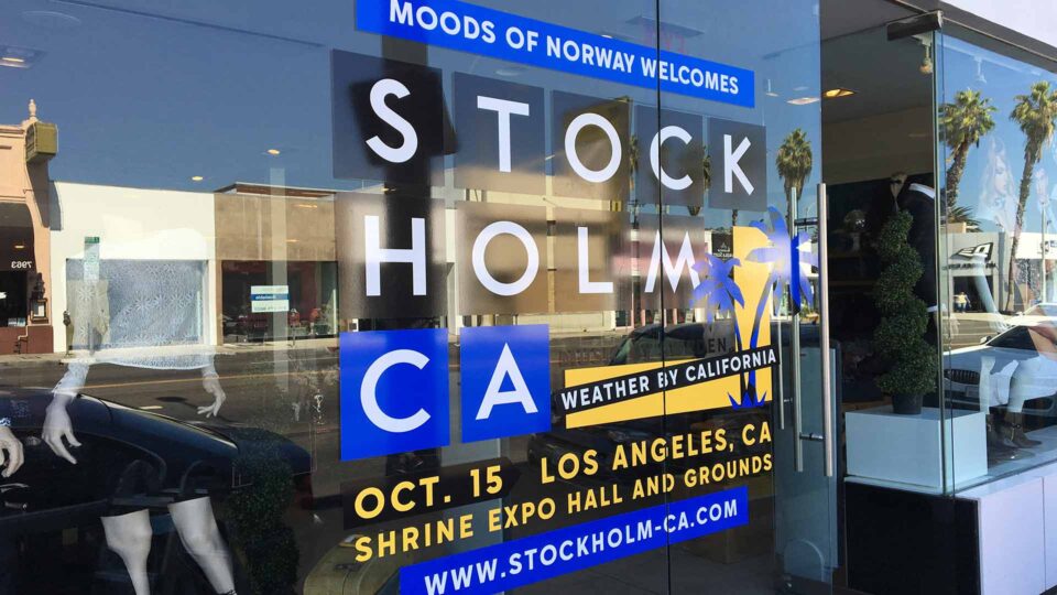 White, yellow and blue die cut window decals for Stockholm Ca