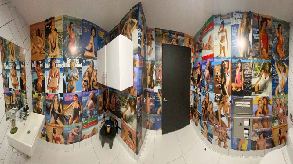 Bathroom wall graphics of Sports Illustrated Swim magazine covers