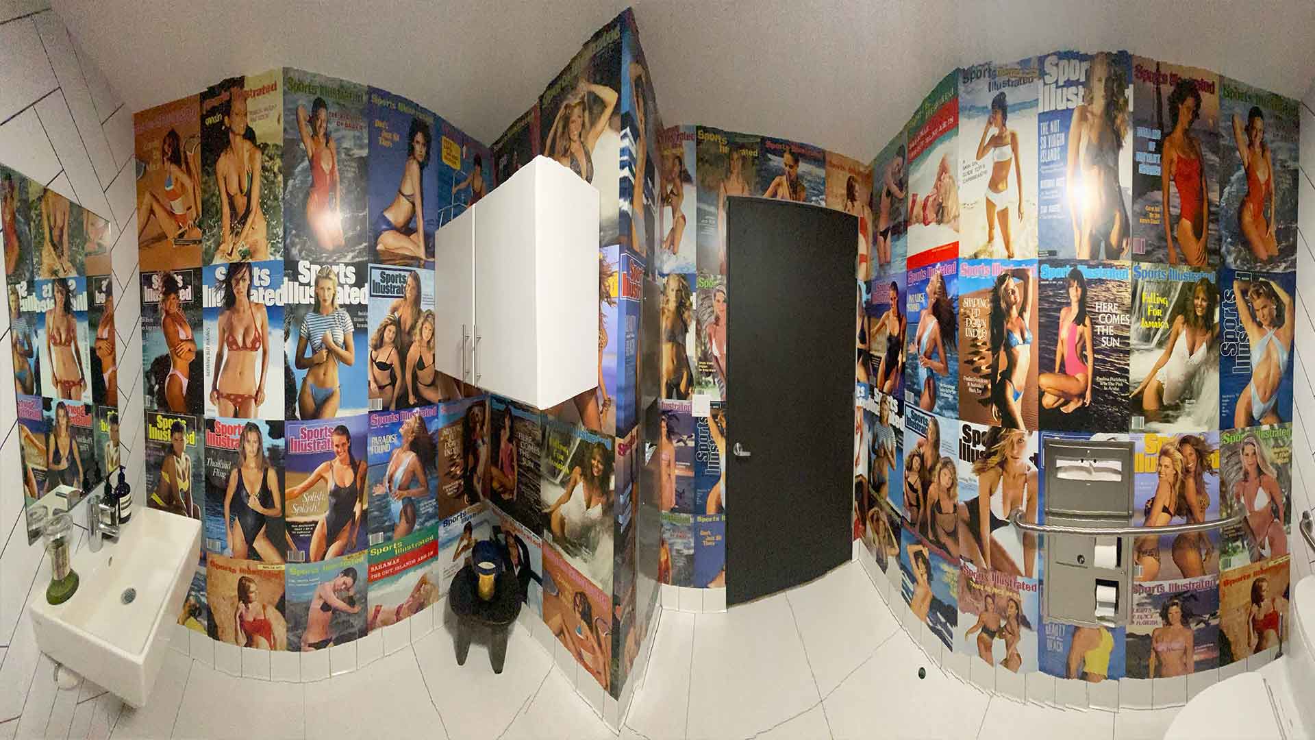 Bathroom wall graphics of Sports Illustrated Swim magazine covers