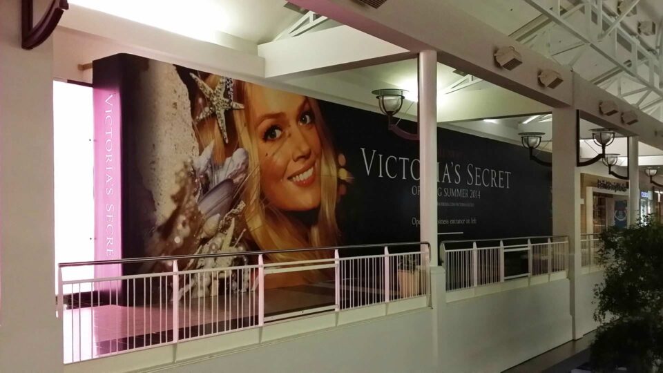 Black background with large face image of a blond Victoria's Secret Model for store coming soon.