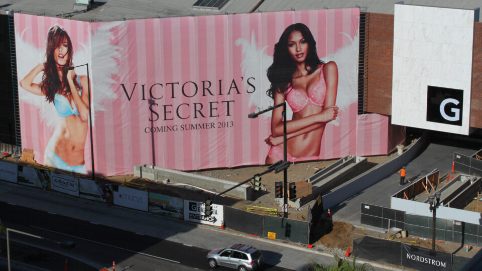 3 Story Pink Striped Victoria's Secret Building Banner featuring 2 angles models in lingerie.