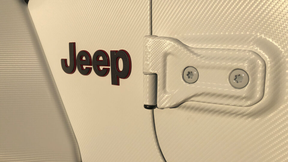 Close up of white carbon fiber Jeep vehicle wrap