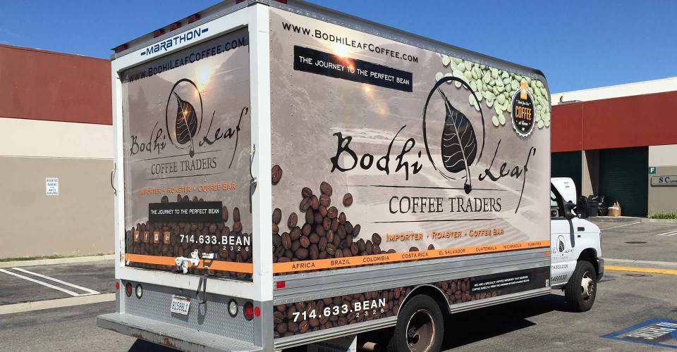 Box truck vehicle wrap with illustrated coffee centered graphics