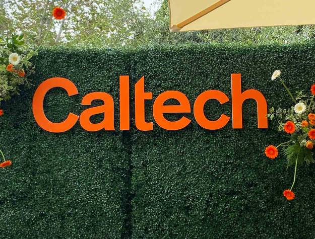 Orange Caltech Sign attached to hedges