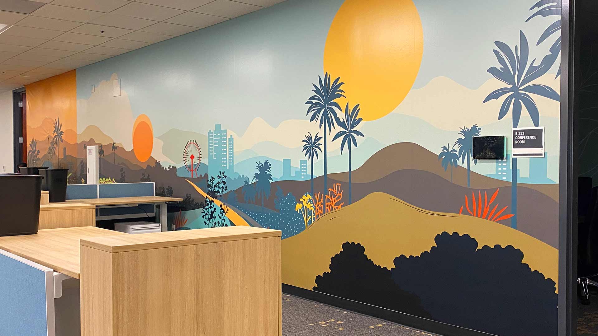 Wall graphic of an illustrated city landscape in an office setting