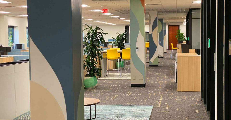 Open floor plan office with pillar wraps