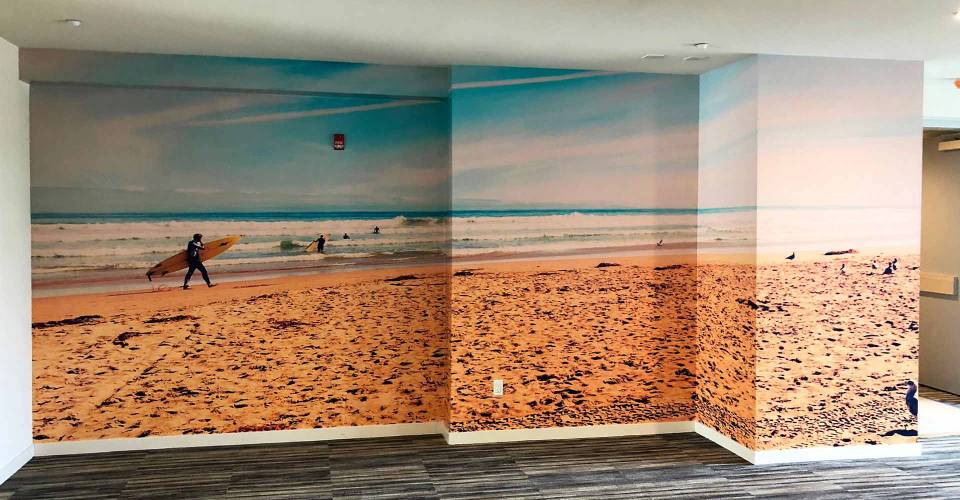 Stepped wall graphic depicting a beach