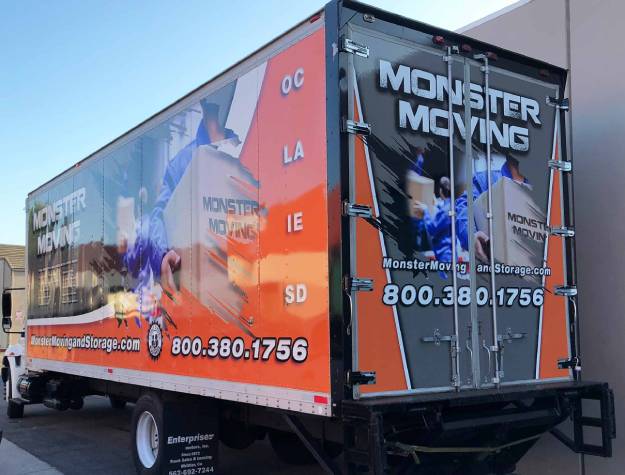 Rear and side view of trailer wrap with gray, white and orane and men in uniforms moving boxes.