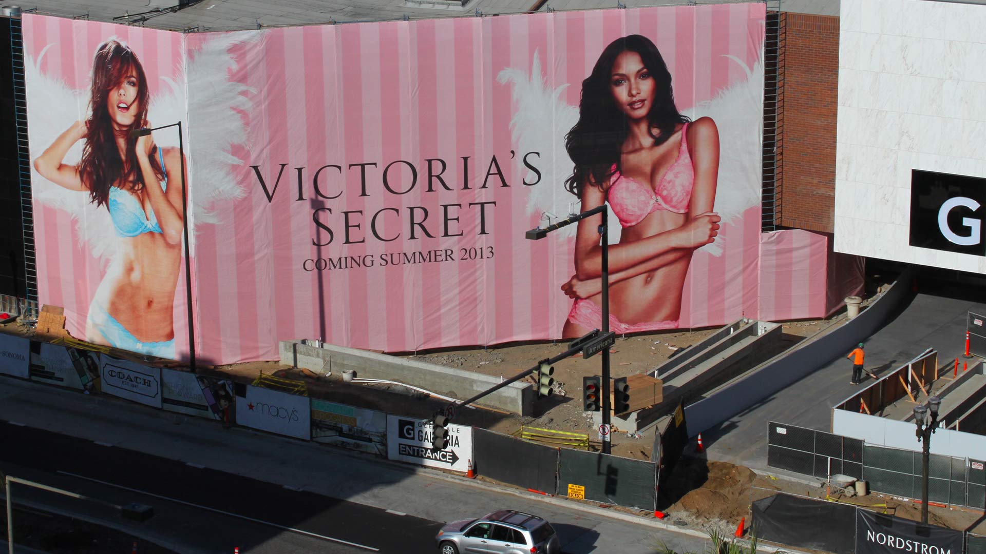 Large multi Story building banner for Victorias Secret featuring models in lingerie