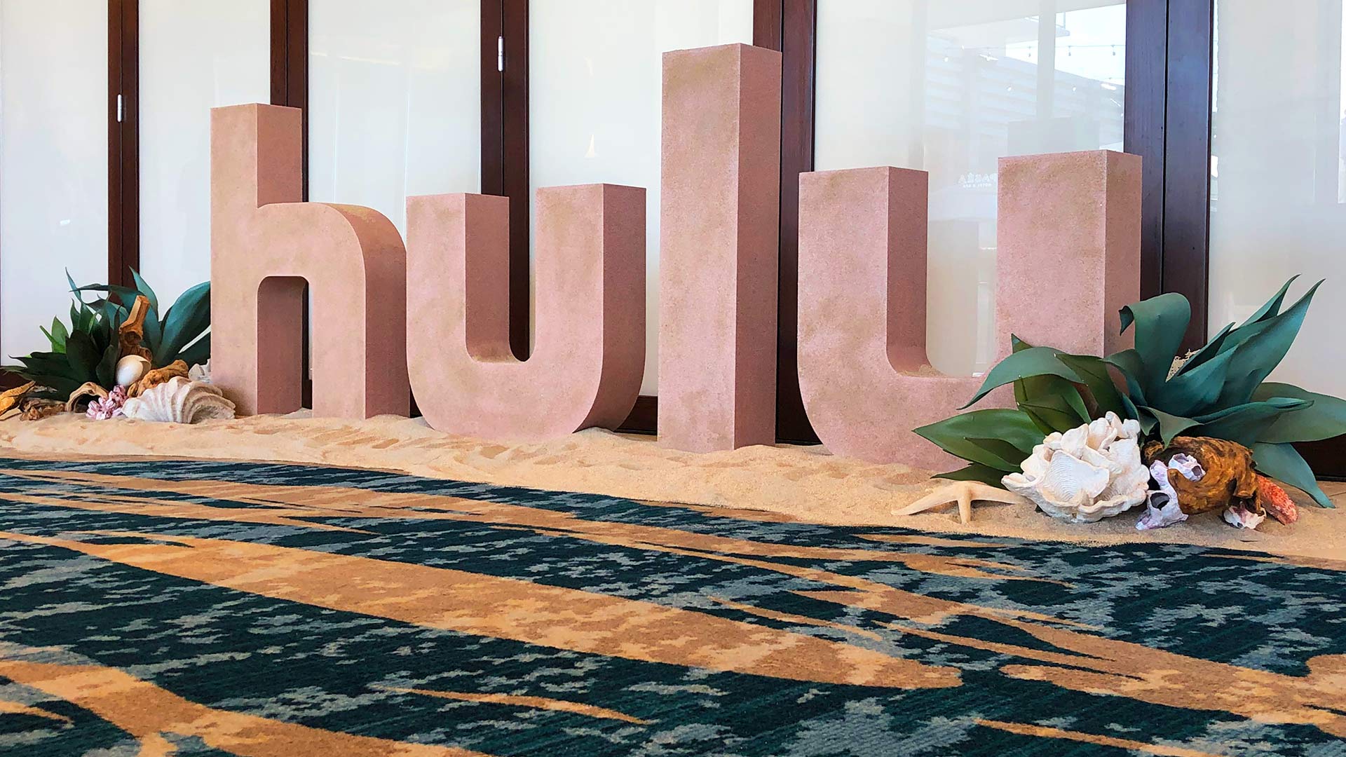 Large router cut HULU logo with sand and beach theme for a special event