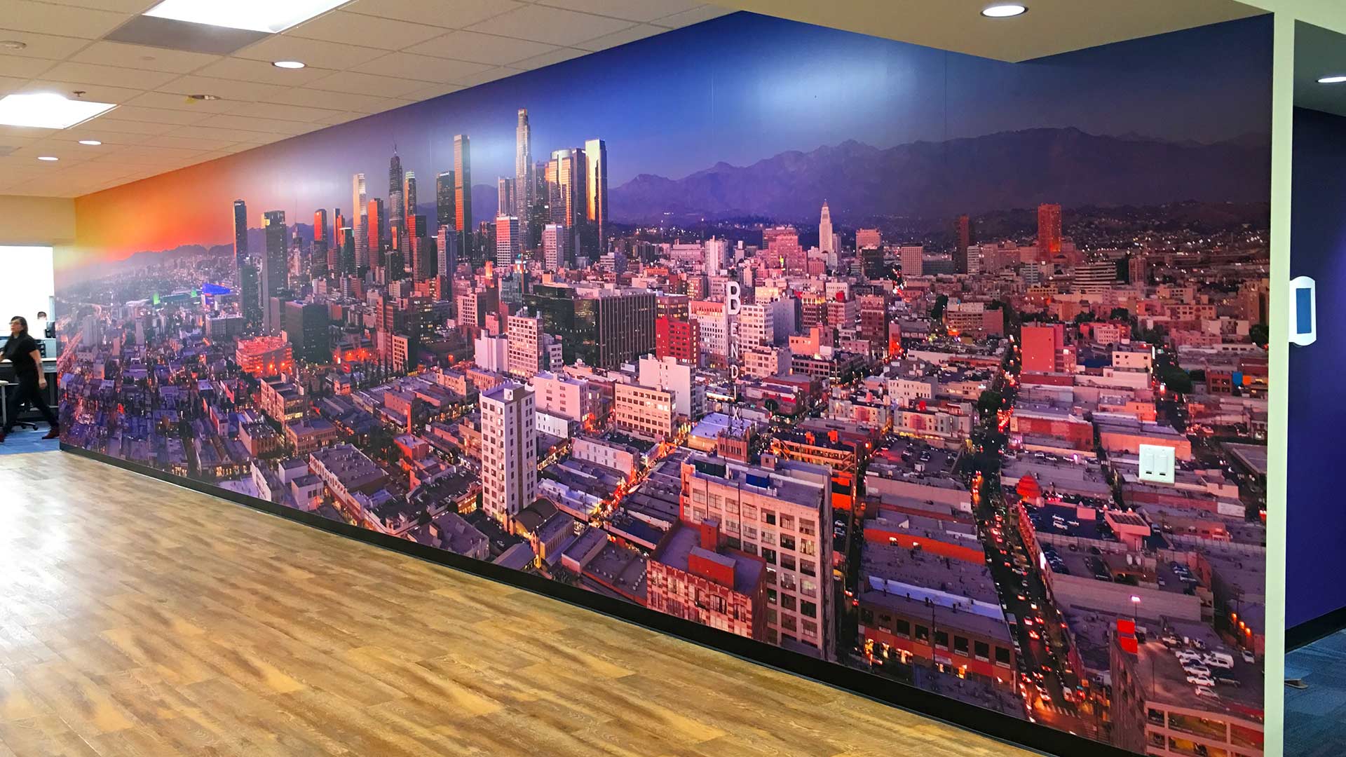 Large-scale full color wall graphic featuring airial view of downtown Los Angeles cityscape for CET Electrical office.